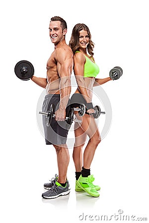 Beautiful fitness young sporty couple with dumbbell Stock Photo