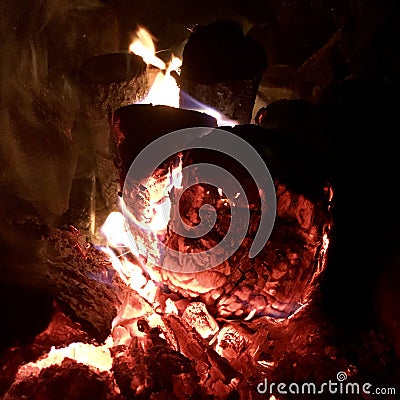 Beautiful flame brown wood dark black coal Stock Photo