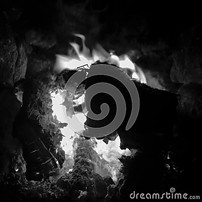 Beautiful flame brown wood dark black coal Stock Photo