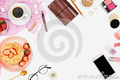 Beautiful flatlay arrangement with cup of coffee, hot waffles with cream and strawberries, smartphone with copyspace and beauty ac Stock Photo