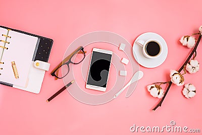 Beautiful flatlay with cup of espresso, cotton branch, sugar cubes, smartphone and planner Stock Photo