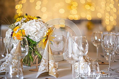 Beautiful floral arrangement or decoration for wedding or event. Sunflower Wedding Table centepiece/ summer colors. Stock Photo