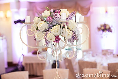 Beautiful floral centerpiece at wedding reception table closeup Stock Photo