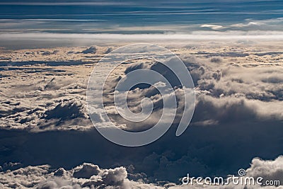 Beautiful fluffy clouds from the window of the plane Stock Photo