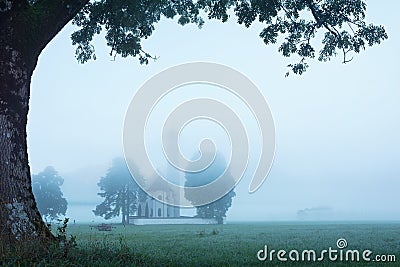 Beautiful foggy landscape with Saint Coloman Church in Bavaria, Germany Stock Photo