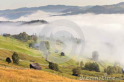 Beautiful foggy morning in the romanian village Stock Photo