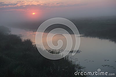Beautiful foggy sunrise in Ukraine. Fog on the field. Untouched nature Stock Photo