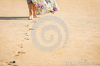 A Beautiful foot footprints in the sand killing on nature background Stock Photo