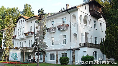 Beautiful formal garden, park with trees, bush, flowers and architecture in medical wellness center Banja Koviljaca Editorial Stock Photo