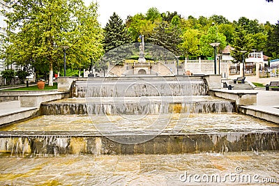Beautiful fountains in downtown of the modern city Ramnicu Valcea. European travel destination. Ramnicu Valcea, Romania - 05.06. Editorial Stock Photo