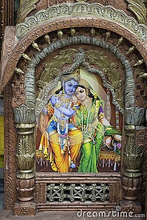 Beautiful framed art of Radha and Krishna, Hindu God, displayed for sale at famous Sardar Market and Ghanta ghar Clock tower in Editorial Stock Photo