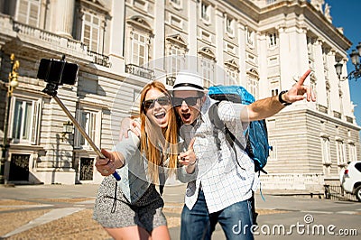 Beautiful friends tourist couple visiting Spain in holidays students exchange taking selfie picture Stock Photo