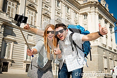 Beautiful friends tourist couple visiting Spain in holidays students exchange taking selfie picture Stock Photo