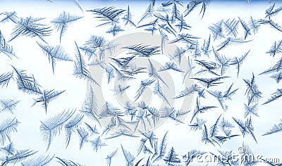 Beautiful frost patterns in the ice feather shape on frozen window as a symbol of Christmas wonder. Christmas or New year Stock Photo