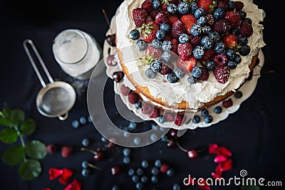 Beautiful, fruit naked cake on a dark tablecloth Stock Photo