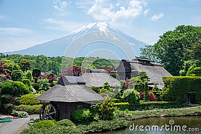 Beautiful Fuji mountain with cloud and blue sky in the summer at Oshino Hakkai the old Japanese village in Japan Stock Photo