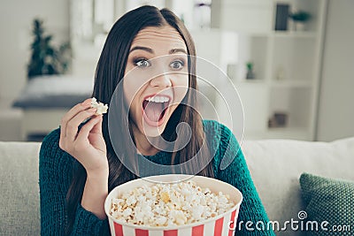 Beautiful funny joking crazy mad emotion expressing she her lady holding hugging large big bucket with popcorn enjoying Stock Photo