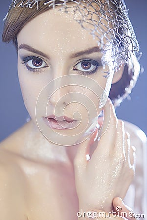 Beautiful futuristic style make up woman with foil and metallic Stock Photo