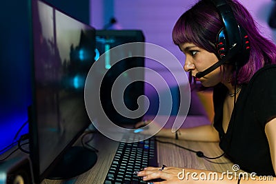 Beautiful gamer with a lot of concentration Stock Photo