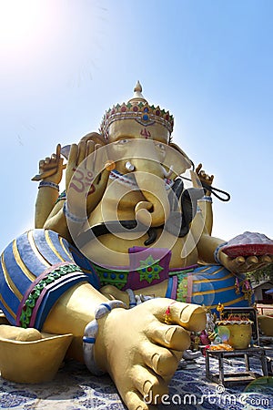 Beautiful Ganesha sitting comfortably outdoors in blue sky Stock Photo