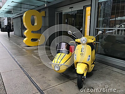 Yellow Scooter and Sidecar in front of Downtown Buildings in Vancouver, British Columbia Editorial Stock Photo