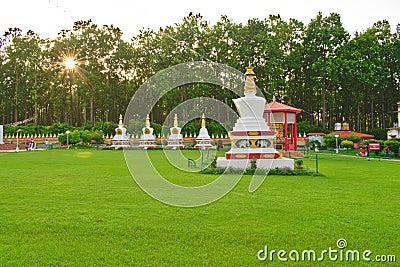 Beautiful garden in the morning with buddha stupa tibetan garden Stock Photo