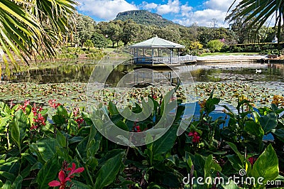 Beautiful garden with pond and summer pavilion Stock Photo