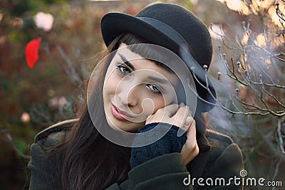 Beautiful gaze from autumn dressed woman Stock Photo