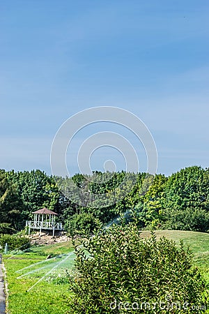 Beautiful gazebo over the green lawn Stock Photo