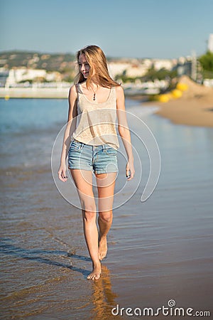 Beautiful girl on the beach in Cannes, France Stock Photo