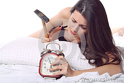 Girl ready to break the alarm clock Stock Photo