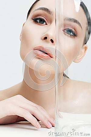 Beautiful girl behind the glass. clean skin young woman Stock Photo