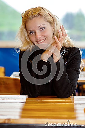 Beautiful girl behind table Stock Photo