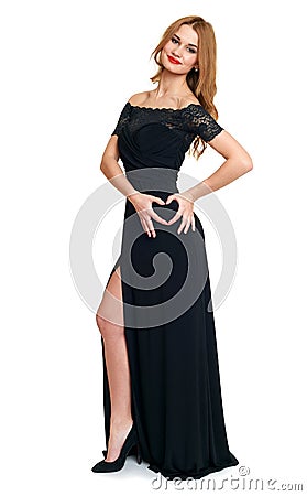 Beautiful girl in black gown show heart symbol from hand, isolated on white background, valentine holiday and romantic concept Stock Photo