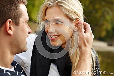 Beautiful girl with boyfriend in park Stock Photo
