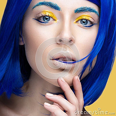 Beautiful girl in a bright blue wig in the style of cosplay and creative makeup. Beauty face. Art image. Stock Photo