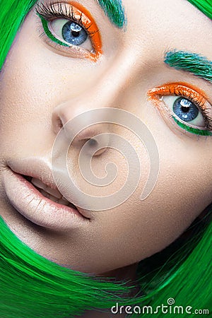 Beautiful girl in a bright green wig in the style of cosplay and creative makeup. Beauty face. Art image. Stock Photo