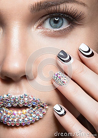 Beautiful girl with bright nails, lips of crystals Stock Photo