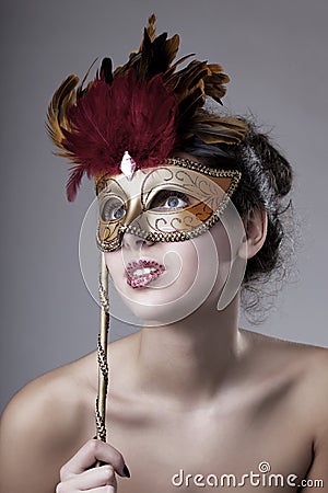 Beautiful girl with a carnival mask Stock Photo