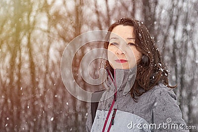 Beautiful girl in casual clothes in winter snowy day Stock Photo