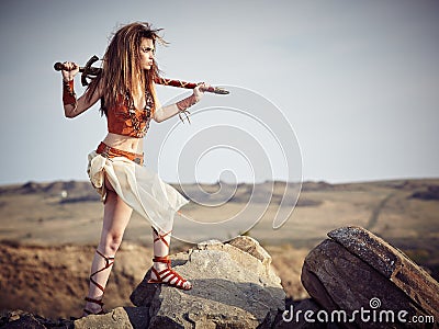 Beautiful girl in the clothes of a Viking or Amazon. Stock Photo