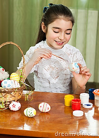 Beautiful girl colored Easter eggs Stock Photo