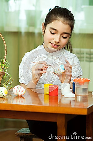 Beautiful girl colored Easter eggs Stock Photo