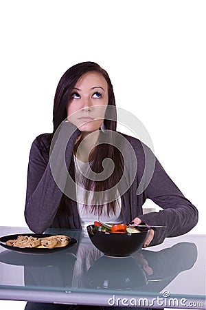 Beautiful Girl Deciding What to Eat Stock Photo