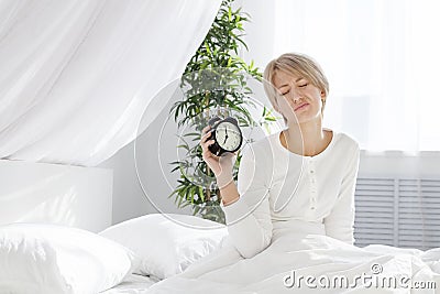 Beautiful girl does not want to get up so early Stock Photo