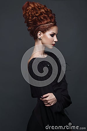 Beautiful girl in evening dress with avant-garde hairstyles. Beauty the face. Stock Photo