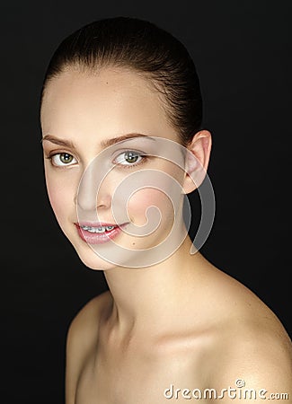 Beautiful girl with evening make-up and smooth hair combed Stock Photo