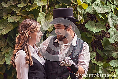 Beautiful girl with a guy, couple in love, in steampunk clothes Stock Photo