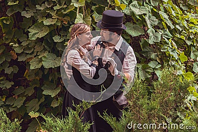 Beautiful girl with a guy, couple in love, in steampunk clothes Stock Photo