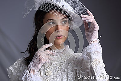 Beautiful girl in a hat with a veil of the XIX century Stock Photo